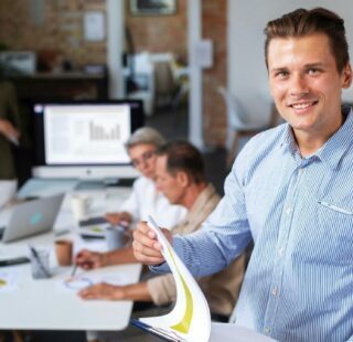 Man smiling in conference room