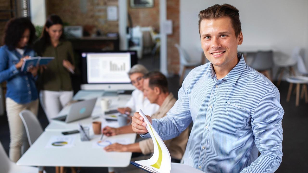 Man smiling in conference room